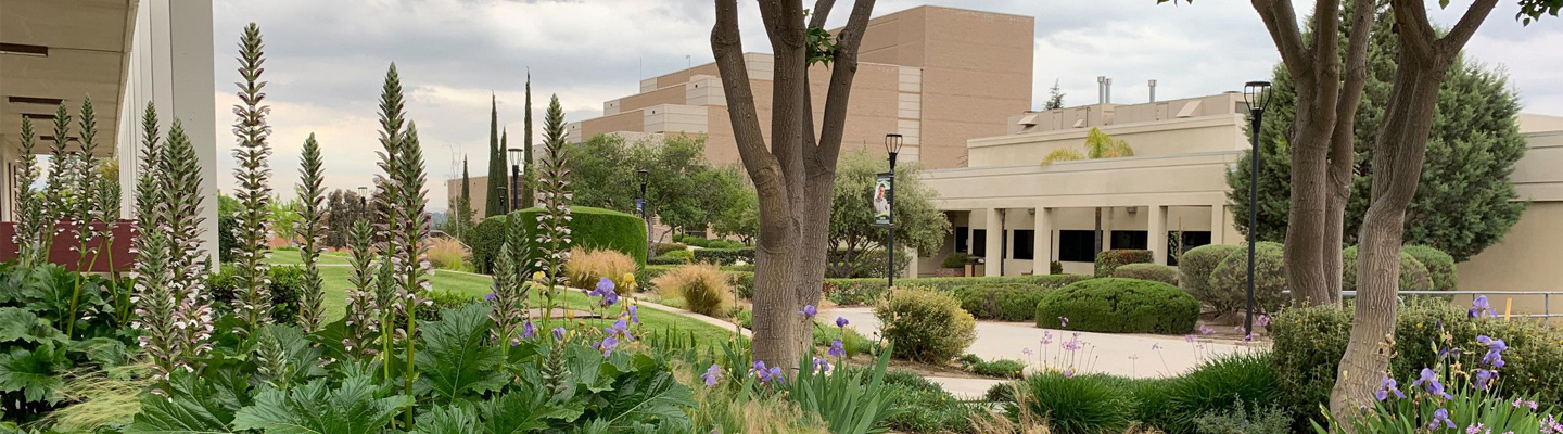 Moorpark Campus with flowers and trees in front of a building