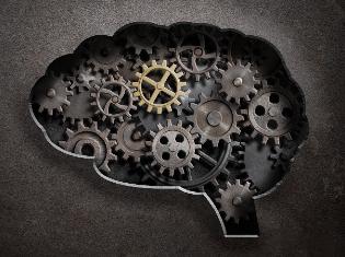A silhouette of the human brain with cogs and gears filled in it.