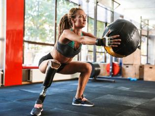 Woman exercising with medicine ball 