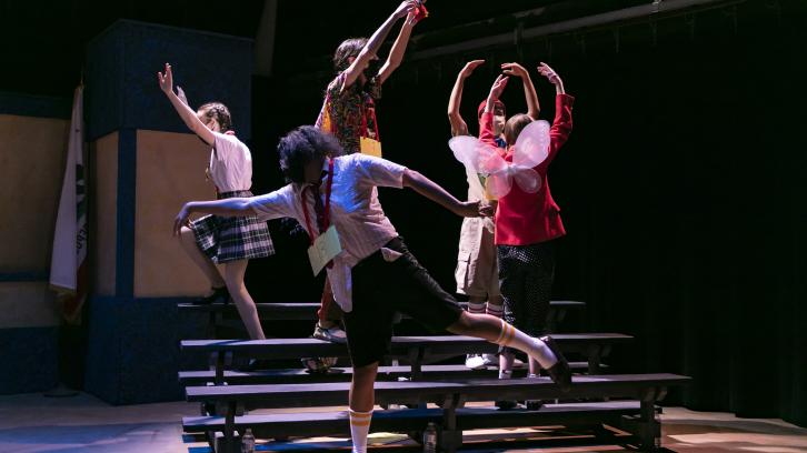 lyrical dancing by the cast on bleachers