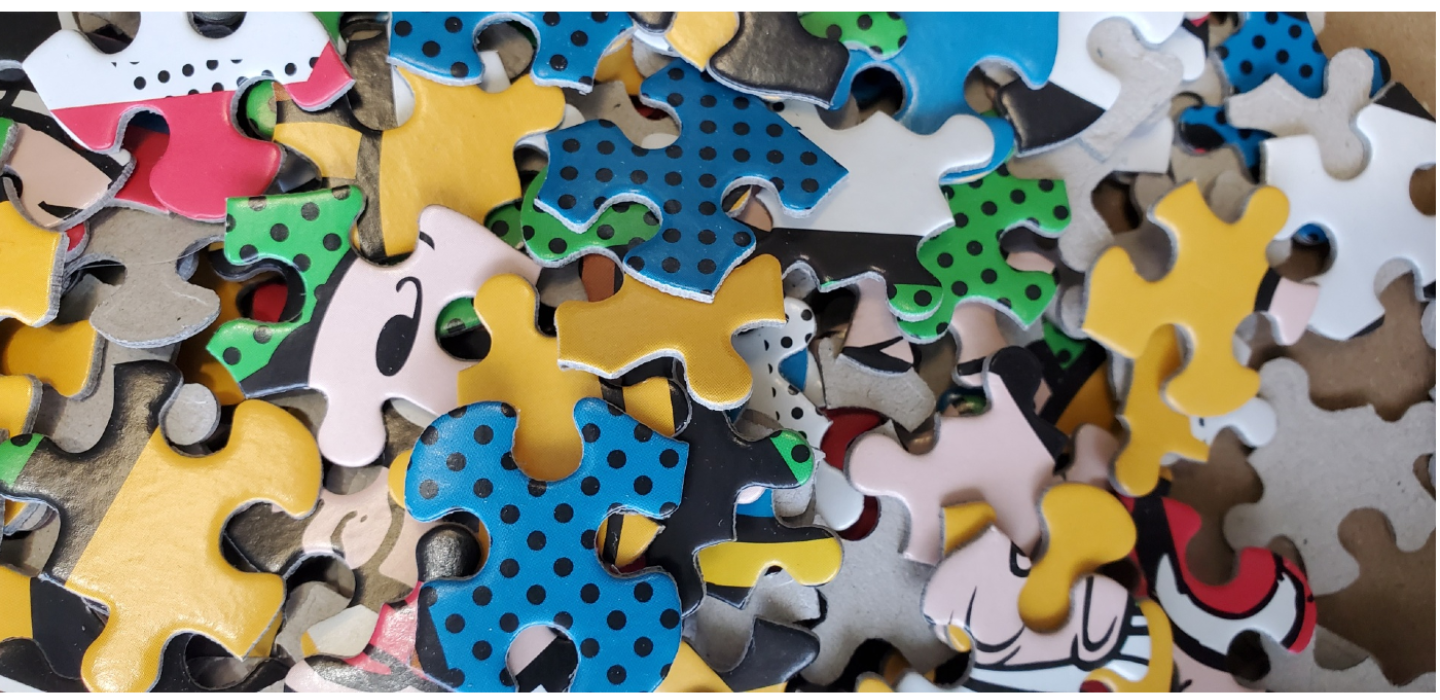 Multicolored puzzle pieces in a mound