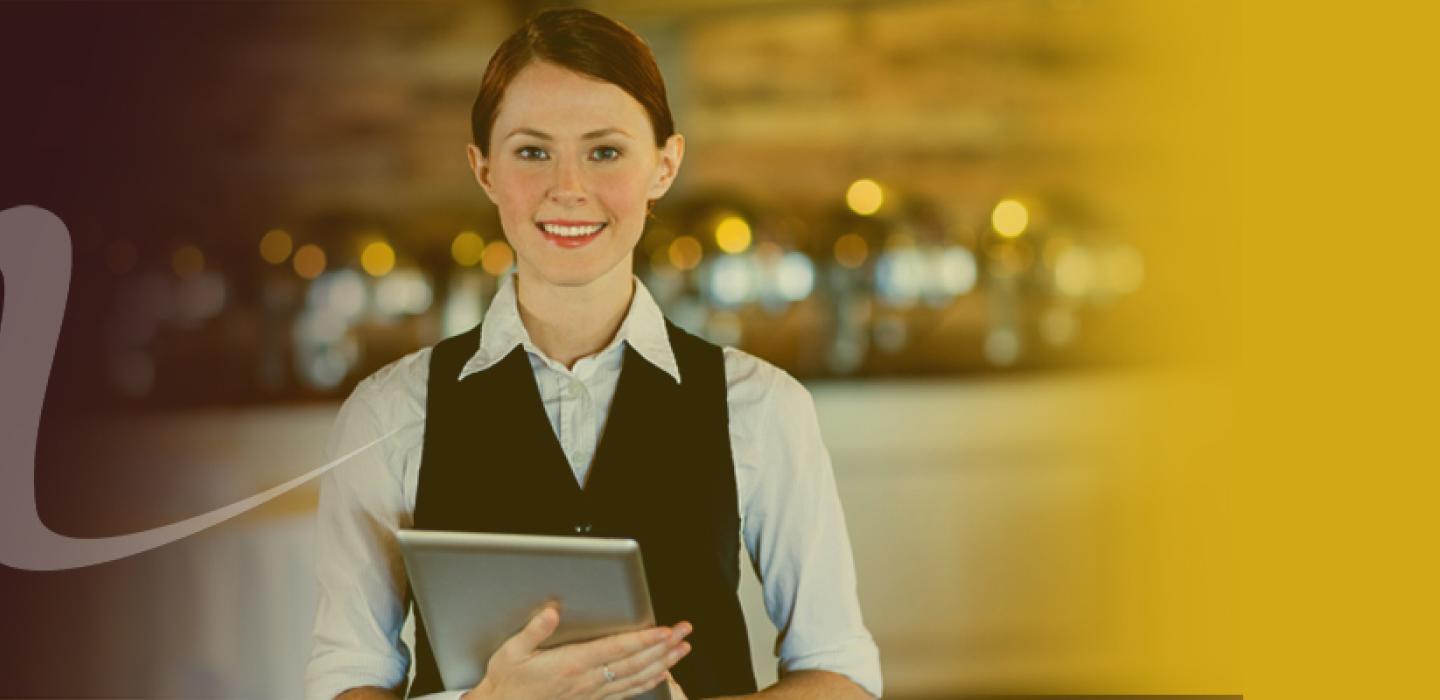 a female restaurant server with Ipad in a resaturant