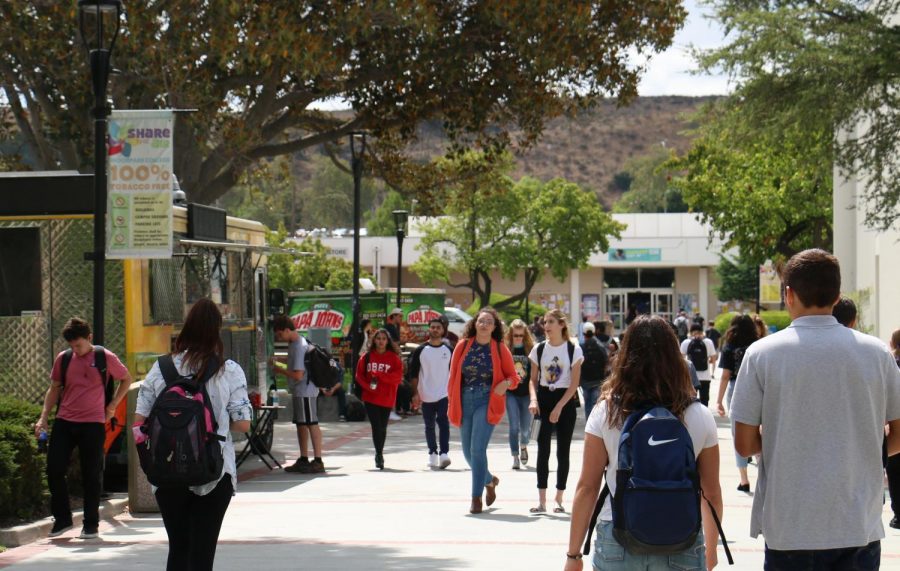 Students walking along Raider Walk