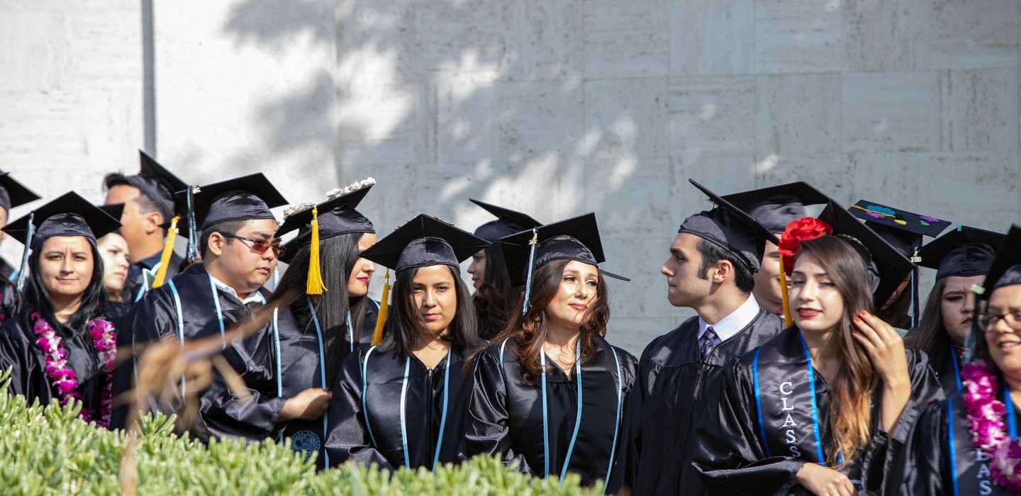 Students line up to walk in the processional at Commencement.