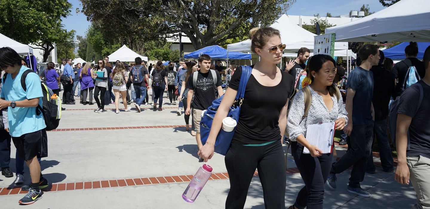 Students walk along Raider Walk.