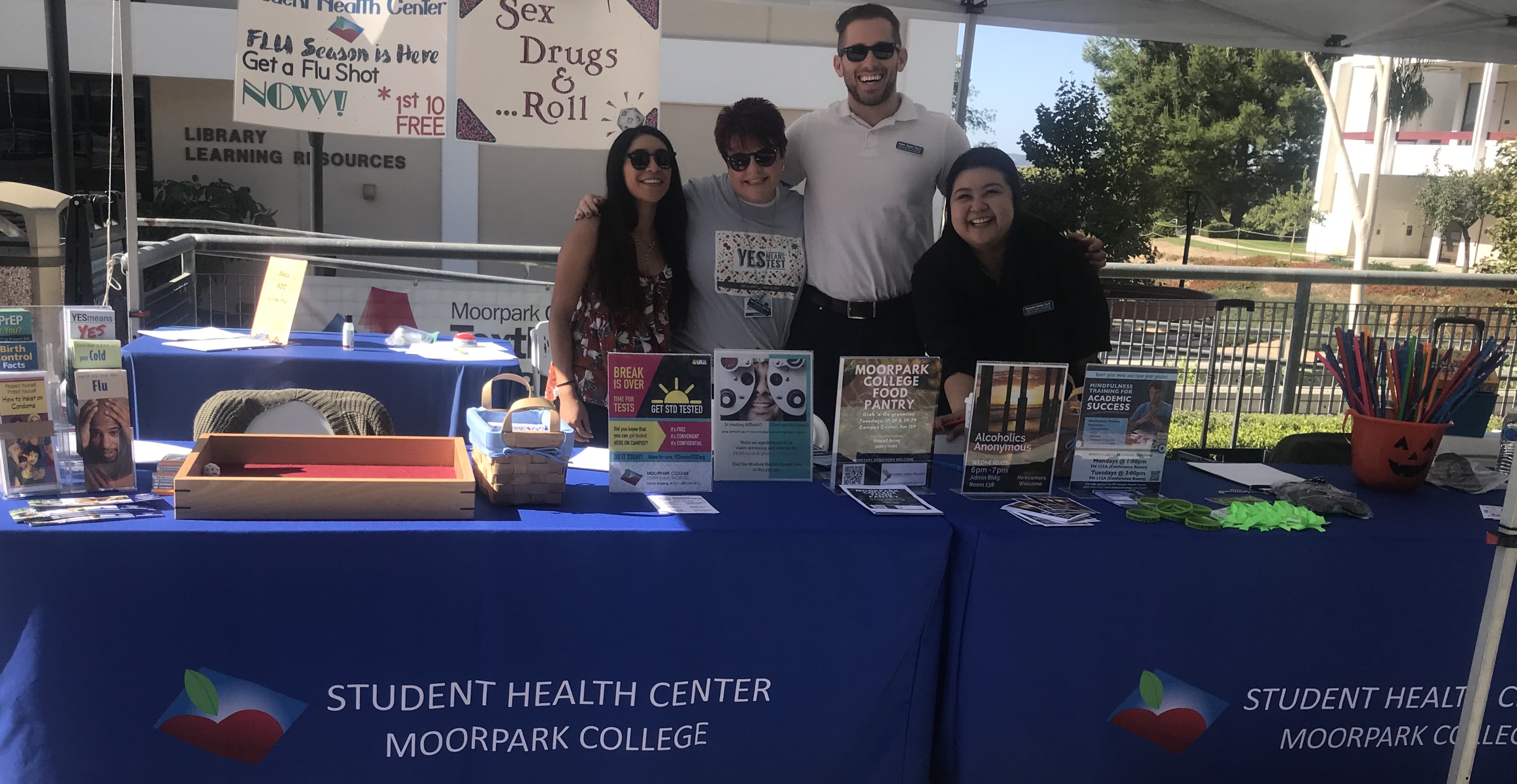 Student Health Center staff and interns having fun tabling at the annual health fair