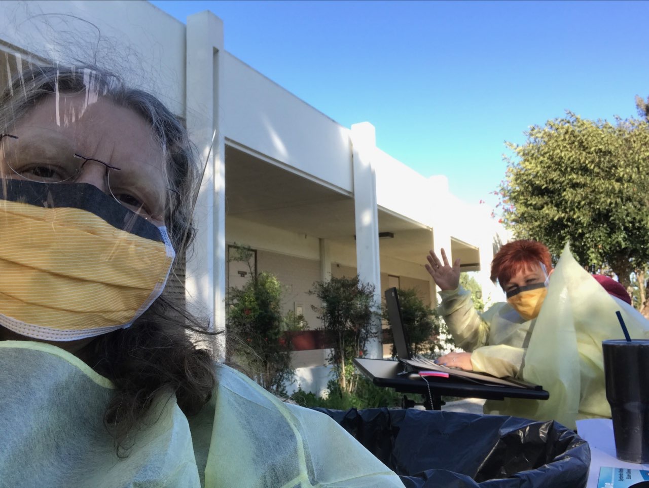 Student health center personnel suited up in personal protective equipment (PPE) and providing care for students during Covid-19 pandemic
