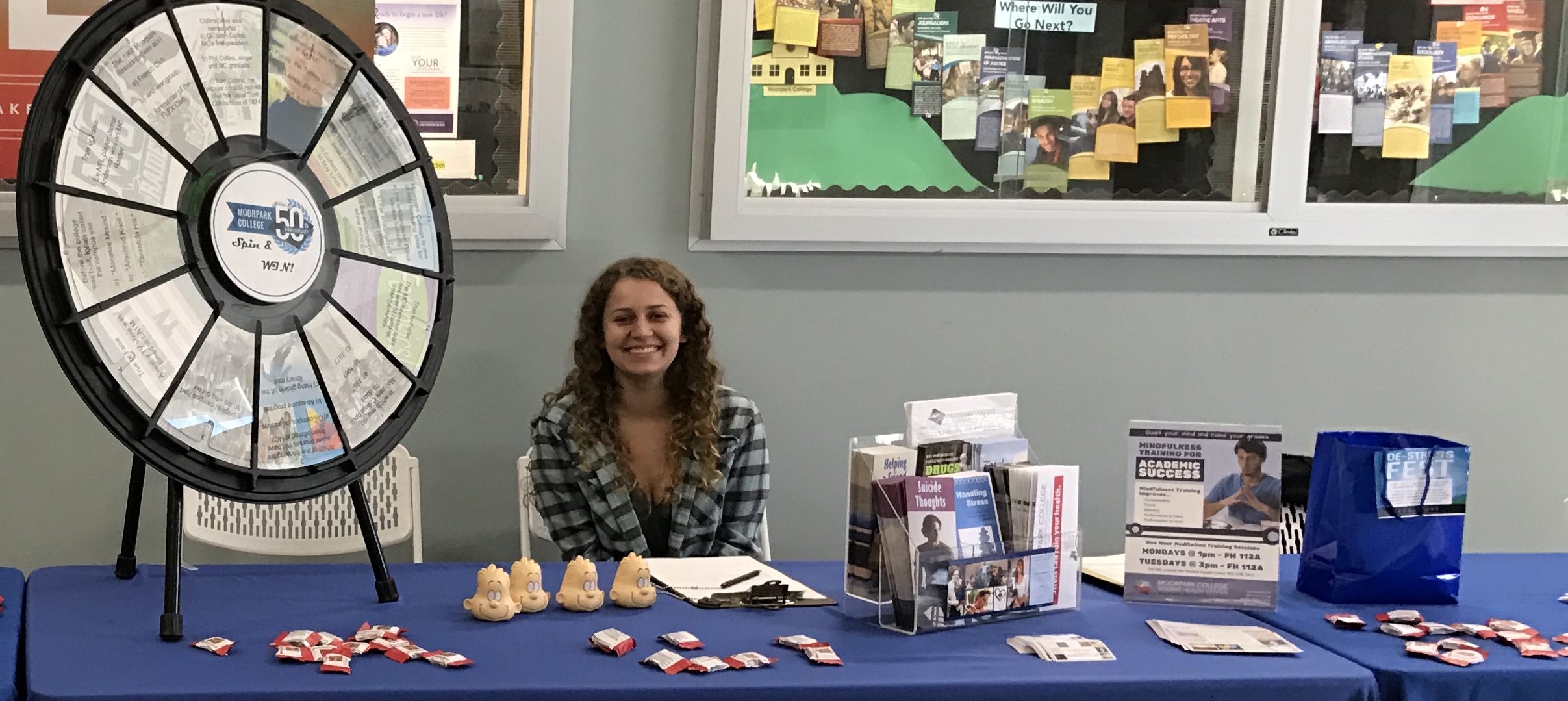 Student Health Center intern leading the MC 50th Anniversary Trivia Game in Fountain Hall