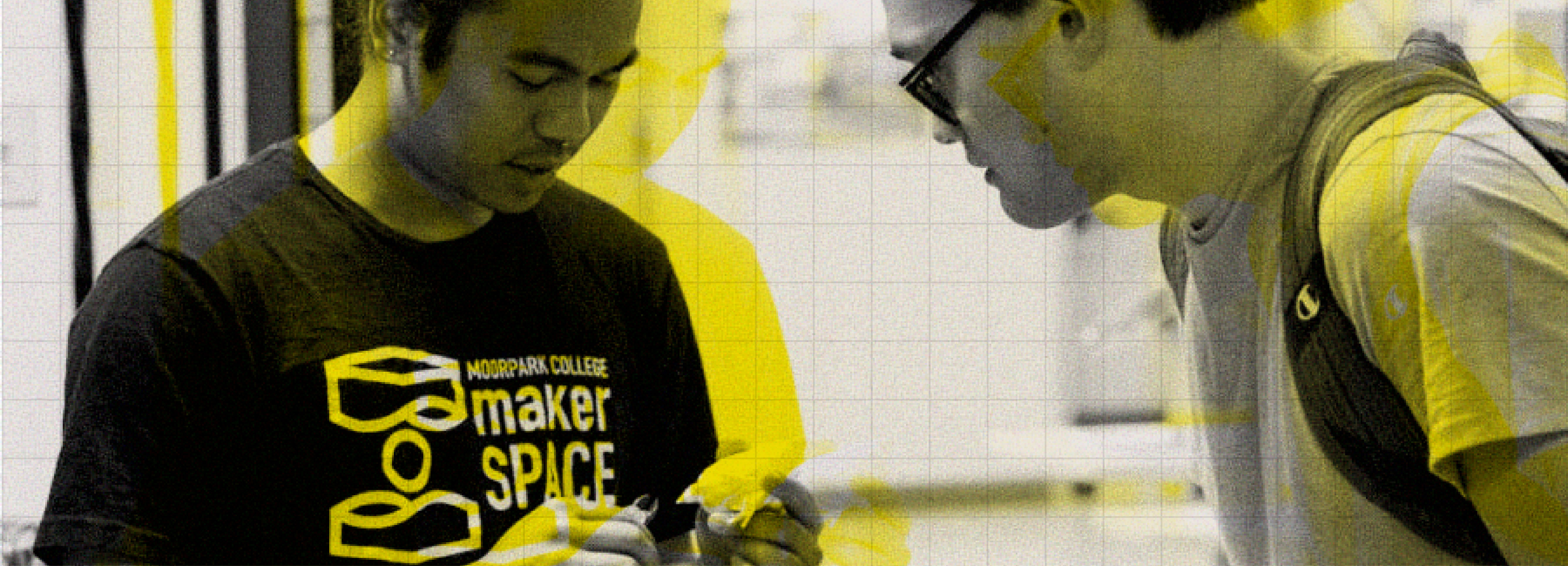 Two students in the MakerSpace looking at a project