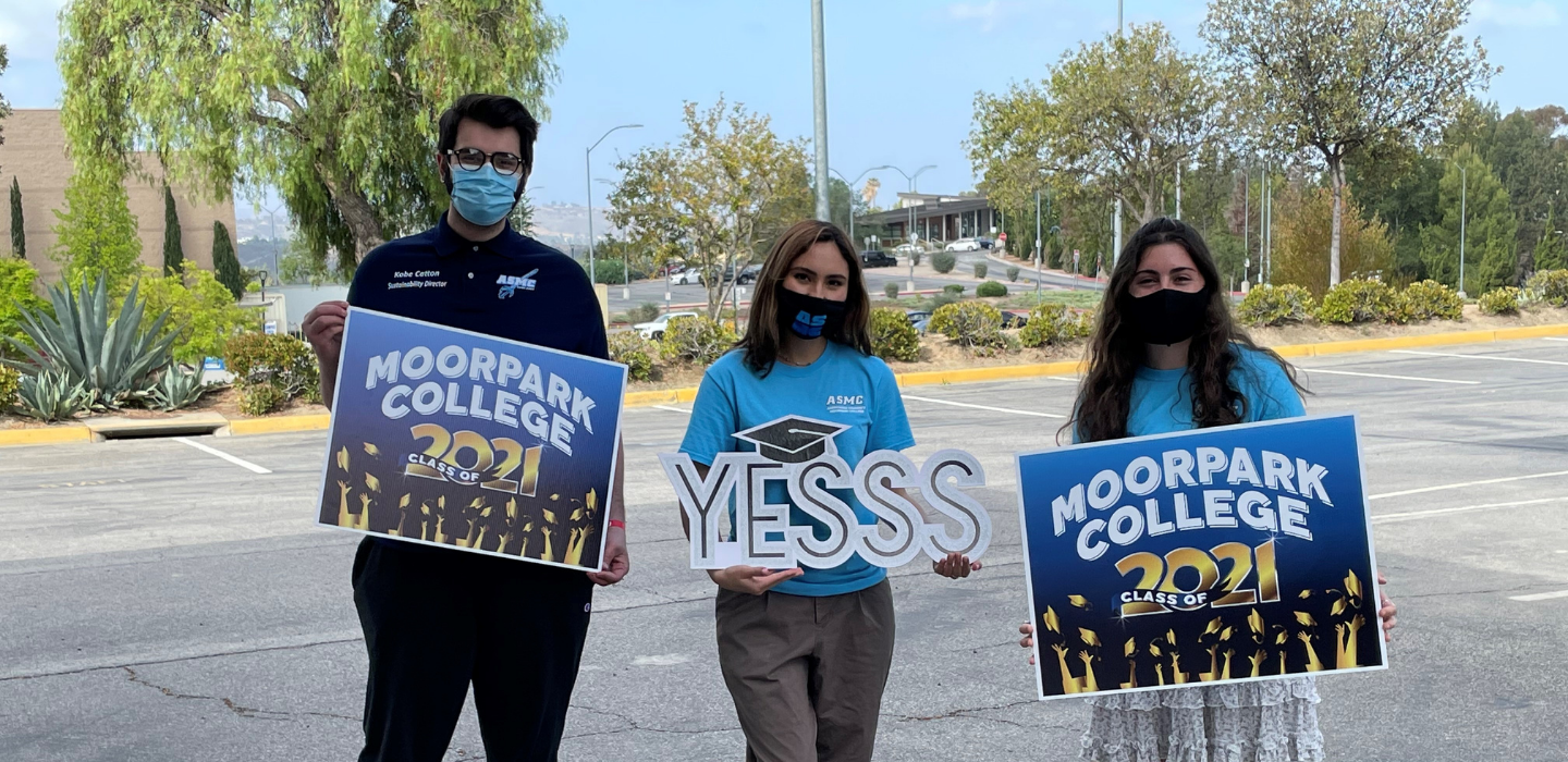 ASMC Board members Kobe, Nicole, and Marina post holding signs that read Moorpark College Class of 2021.