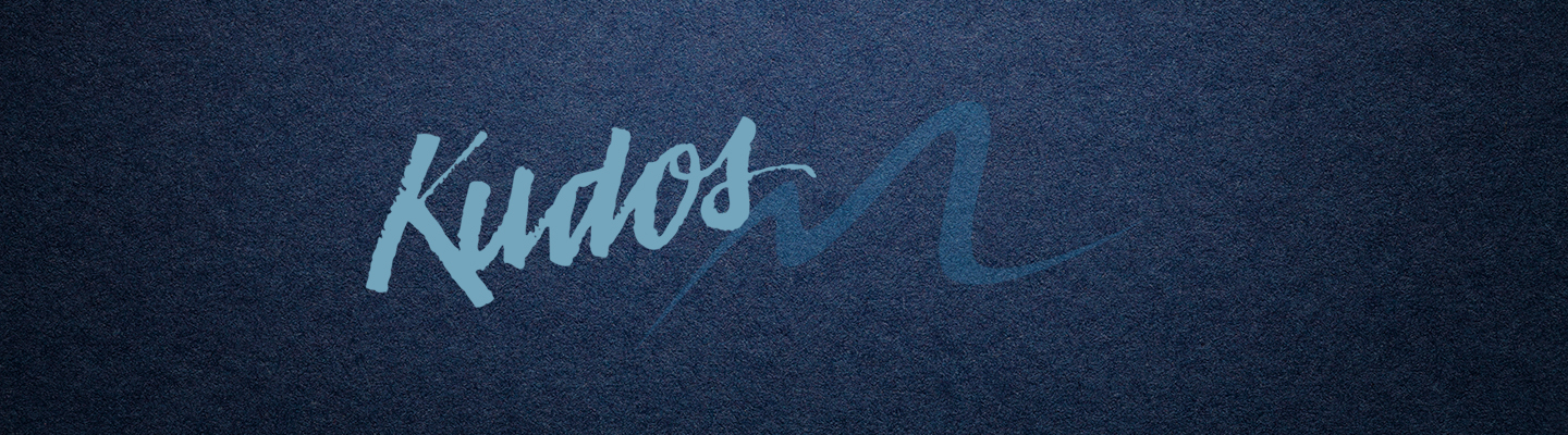 The word KUDOS over a muted blue background