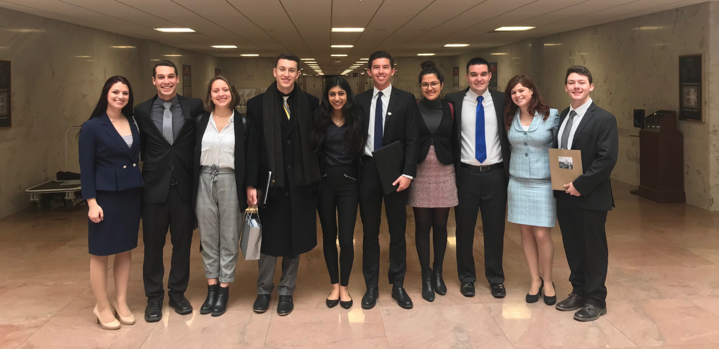 Members of the Associated Students pose in the Hart Senate Building.