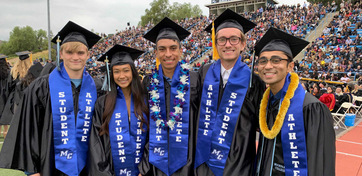 Student Athletes pose for photo at 2022 Commencement