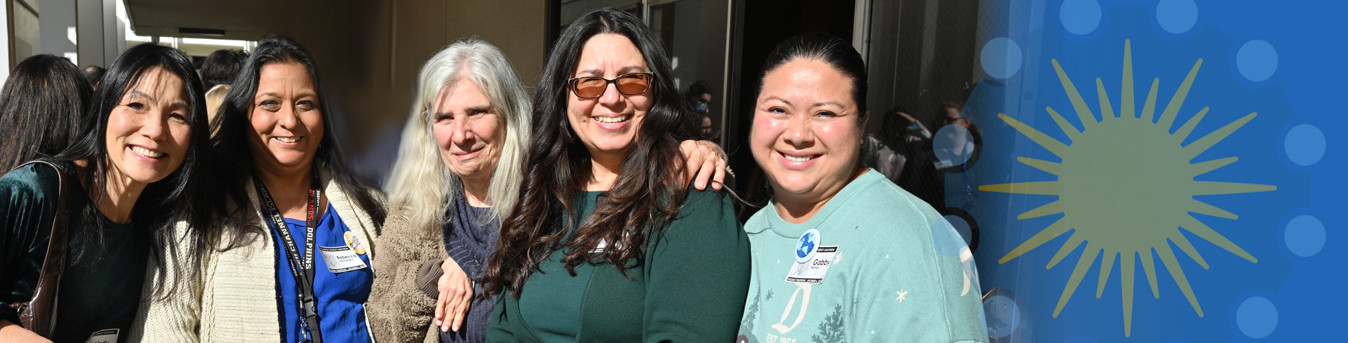 group smiles at Holiday Lunch event
