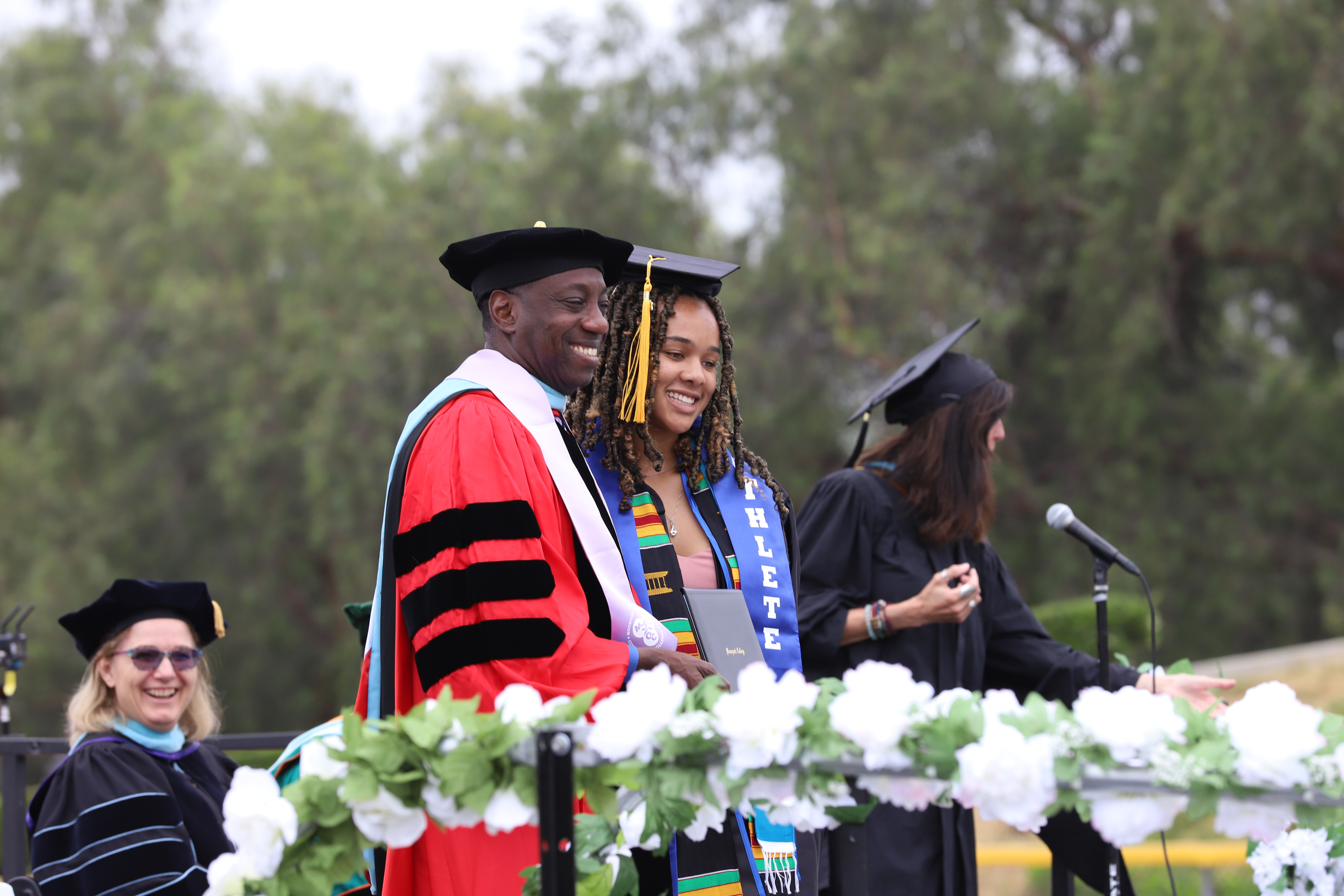 Moorpark College President Julis Sokenu and Student at graduation ceremony