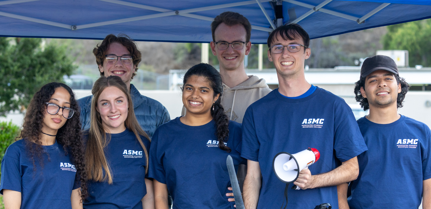 Members of the Associated Students of Moorpark College smile while supporting the football team at a home game.