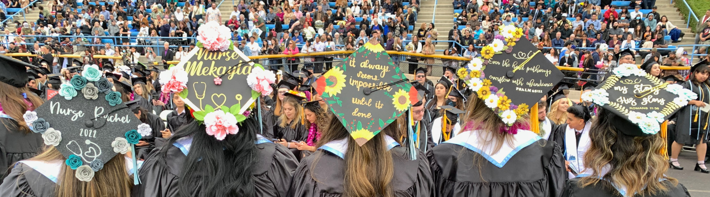 Nursing grads with personalized caps