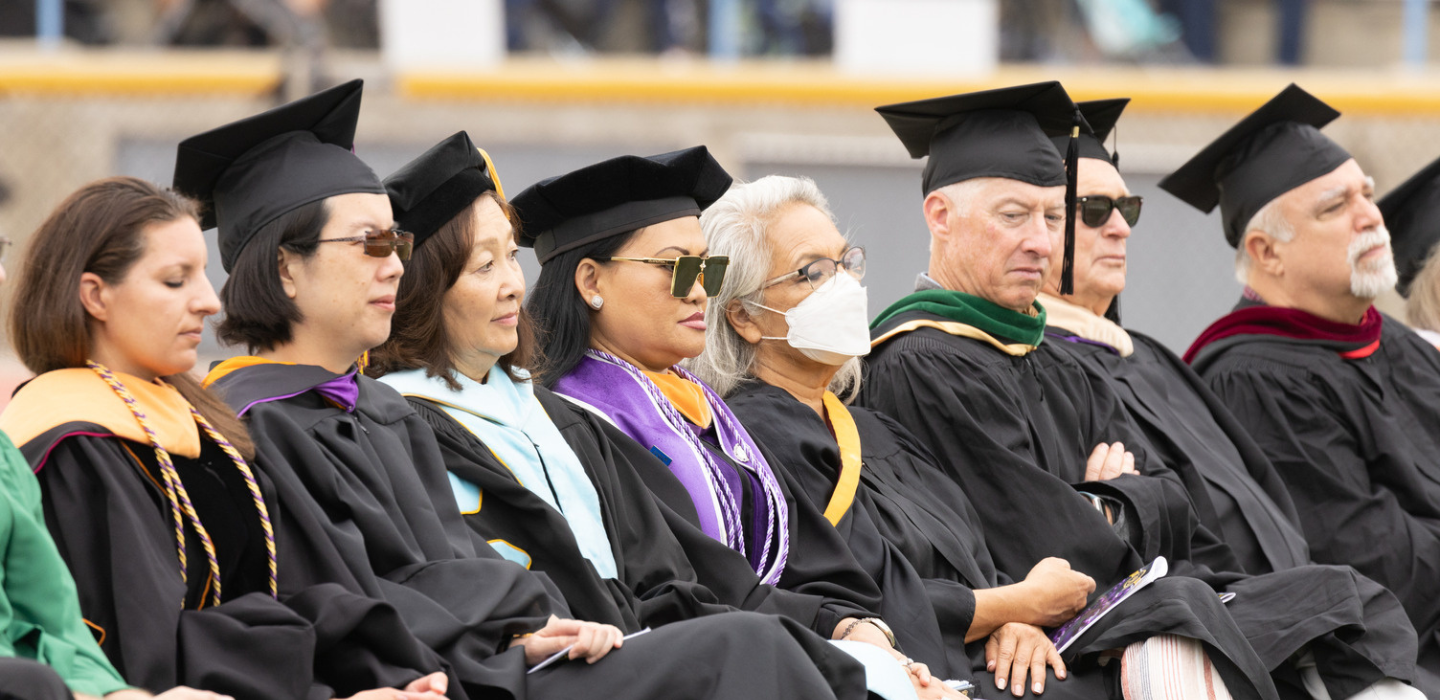 Faculty participate in the procession to support graduates during Commencement.