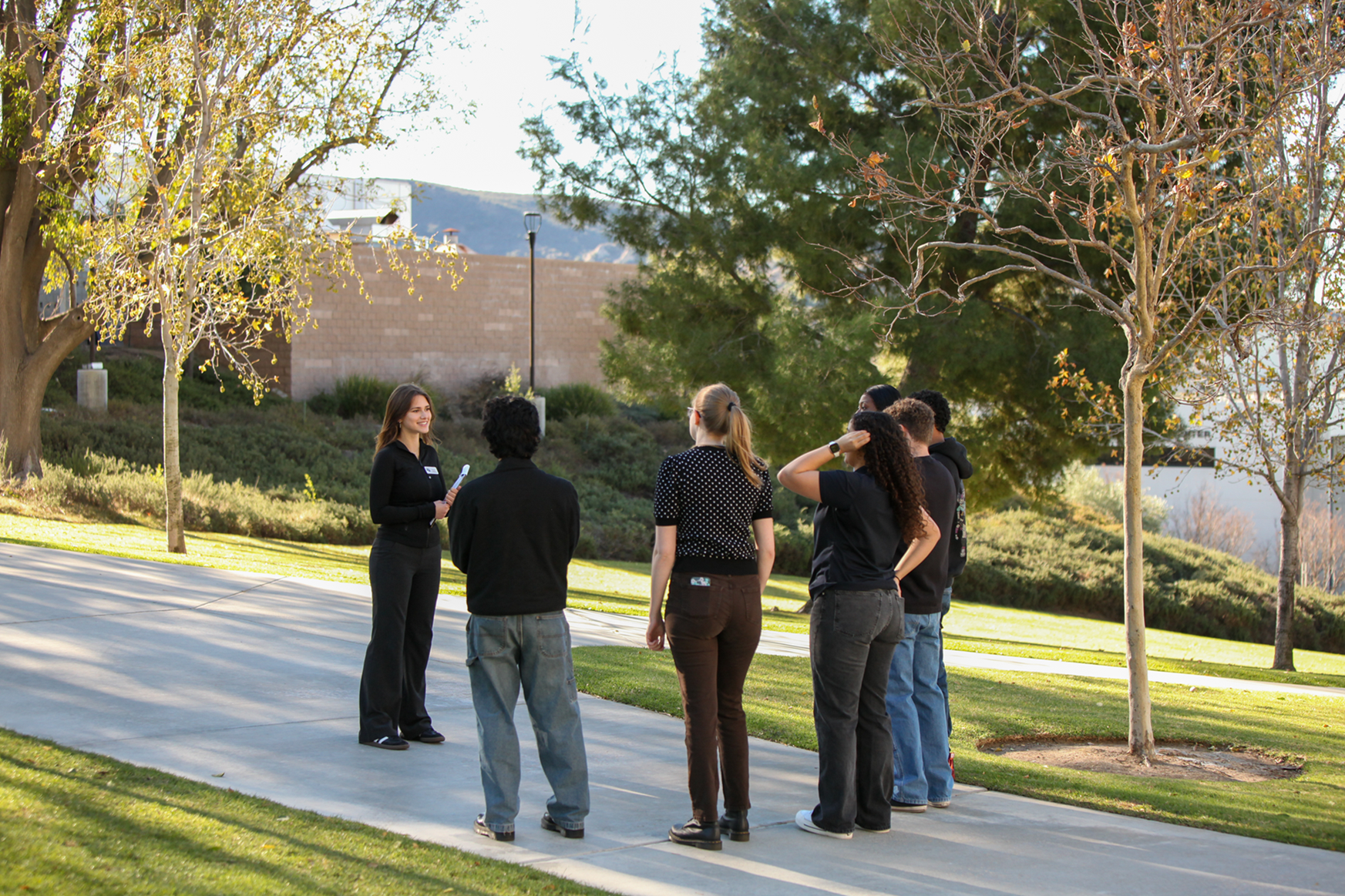 Student giving a guided tour to a group