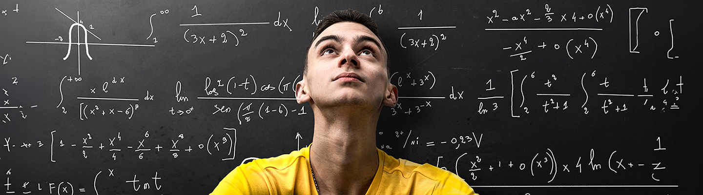 young man in front of math board
