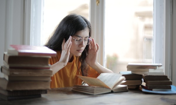 Female student suffering from a headache