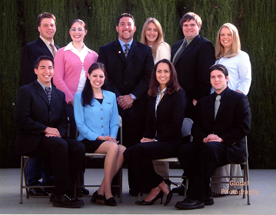 The 2003-2004 ASMC Board poses together for a photo.