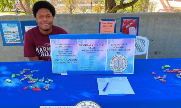 Student at the Honors Program booth