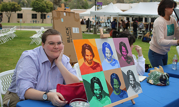 A student exhibiting art at the 2019 Moorpark College Maker Space Fair.