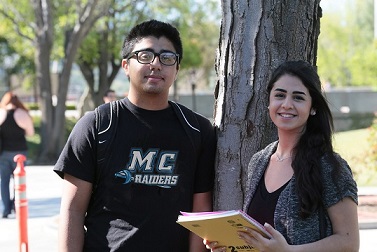 Two EOPS students outside on campus