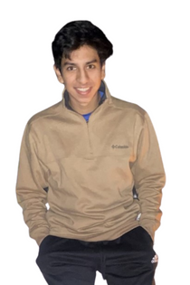 Chris Ojeda poses for a photo with a smile.