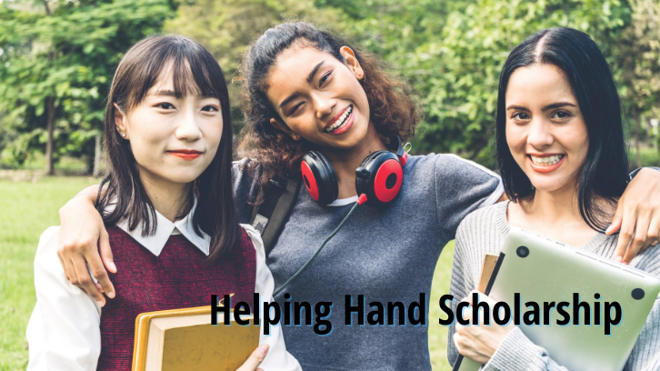 A trio of female international students pose for a photo.