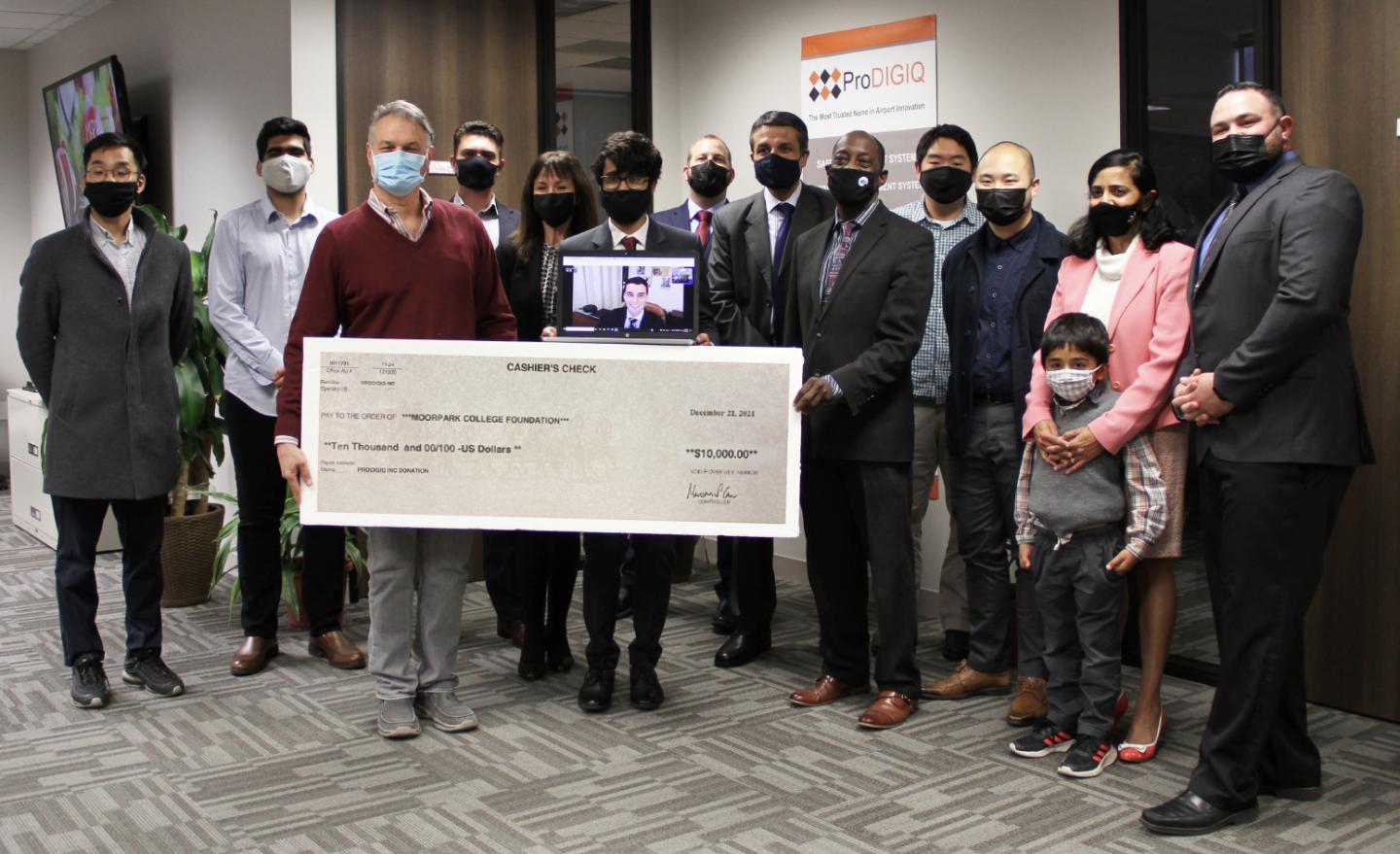 ProDIGIQ Presents a $10,000 donation to the Moorpark College Foundation at the company’s Thousand Oaks offices on Dec. 22. Pictured are, front row: John Loprieno, interim director of Institutional Advancement and Community Relations at Moorpark College; Julius Sokenu, Moorpark College President; and members of the ProDIGIQ team.