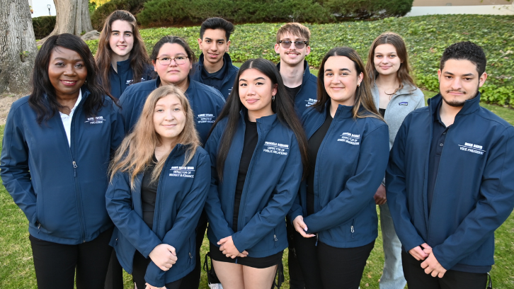 Associated Student officers from 2021-2022 pose for a group photo outside.