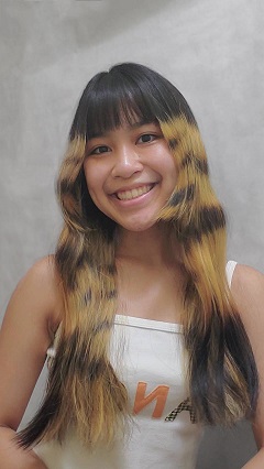 Angela Batoon, Director of Public Relations poses for a photo