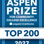 Blue and white graphic badge that reads: “Aspen Prize for Co