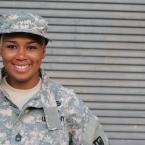 U.S. Army soldier woman of color smiling.