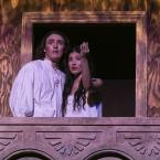 Two theatre students on a stage balcony. 