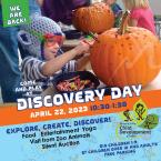 Discovery Day at CDC child playing with a pumpkin