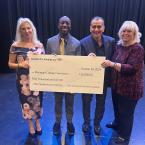 Debi Klein, President Julius Sokenu, Ed Garcia, and Jill Haney hold a large check for $50,000 from Bank of America awarded to the Moorpark College Foundation