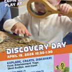 Discovery Day toddler with magnifying glass looking at shells