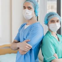Nurses wearing scrubs and masks