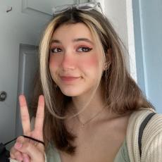 picture of Daniella holding up a peace sign