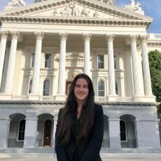 picture of Alette smiling in front of the California State Capitol building