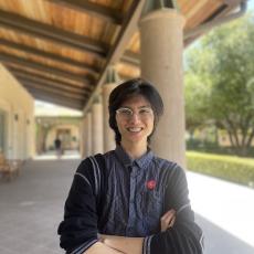 ASMC Vice President Jaycee Alipio is shown smiling for a picture outside of a building.