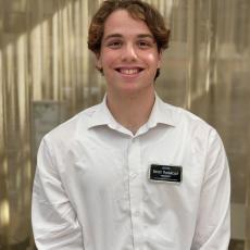 Student shown posing for a photo