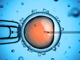 An enlarged depiction of a molecular cell being probed with a needle.