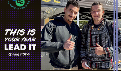 Two student leaders standing side by side outdoors on campus