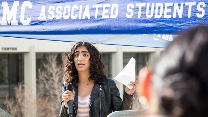 A student addresses the crowd at an anti-gun violence rally.