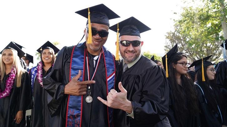 Students smile for the camera before the Commencement ceremony begins.