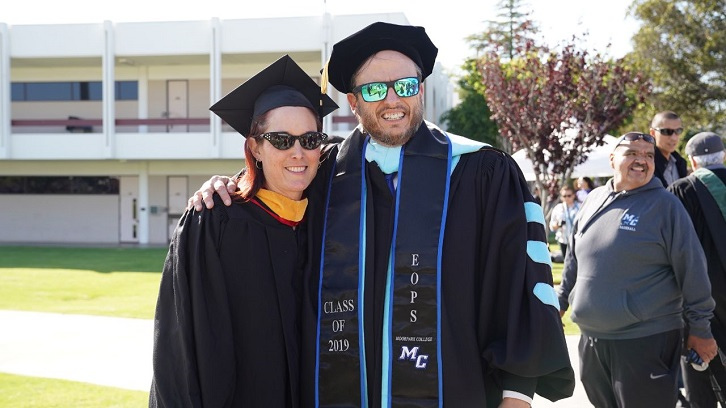 Faculty pose for a photo during the 2019 Commencement.
